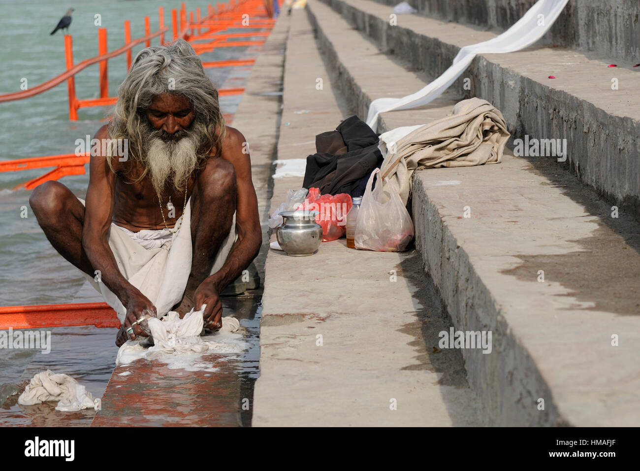 Haridwar, India - November 11, 2009: Indians pilgrim doing the washing above the bank of the Ganges River in the holy city Haridwar, November 11, 2009 Stock Photo