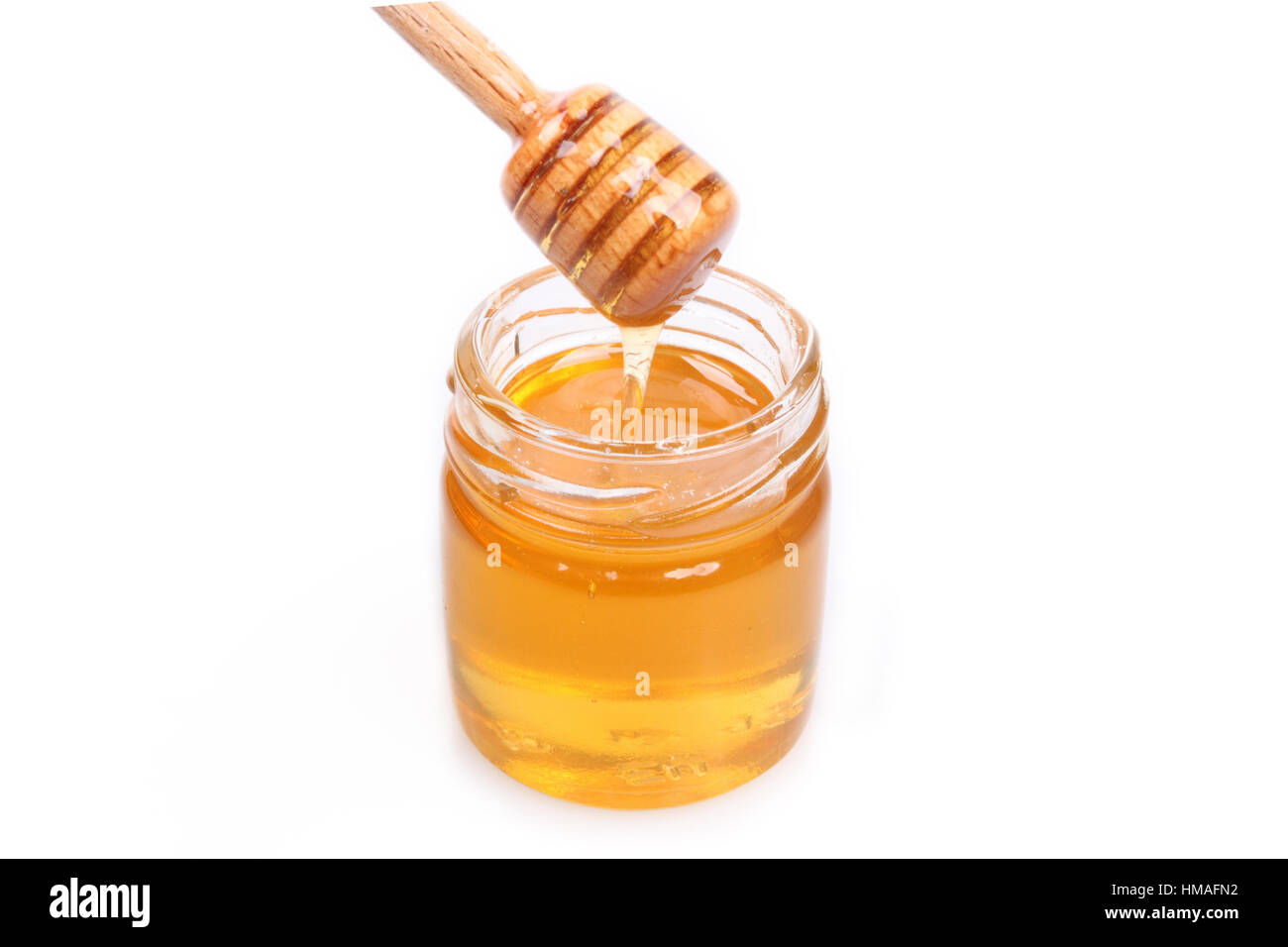 honey jar with wooden spoon Stock Photo Alamy