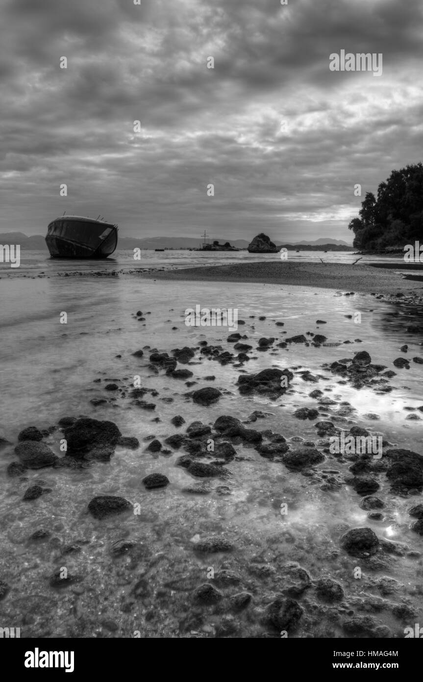 Shipwreck on the beach in South Corfu Greece Europe in black and white. Stock Photo