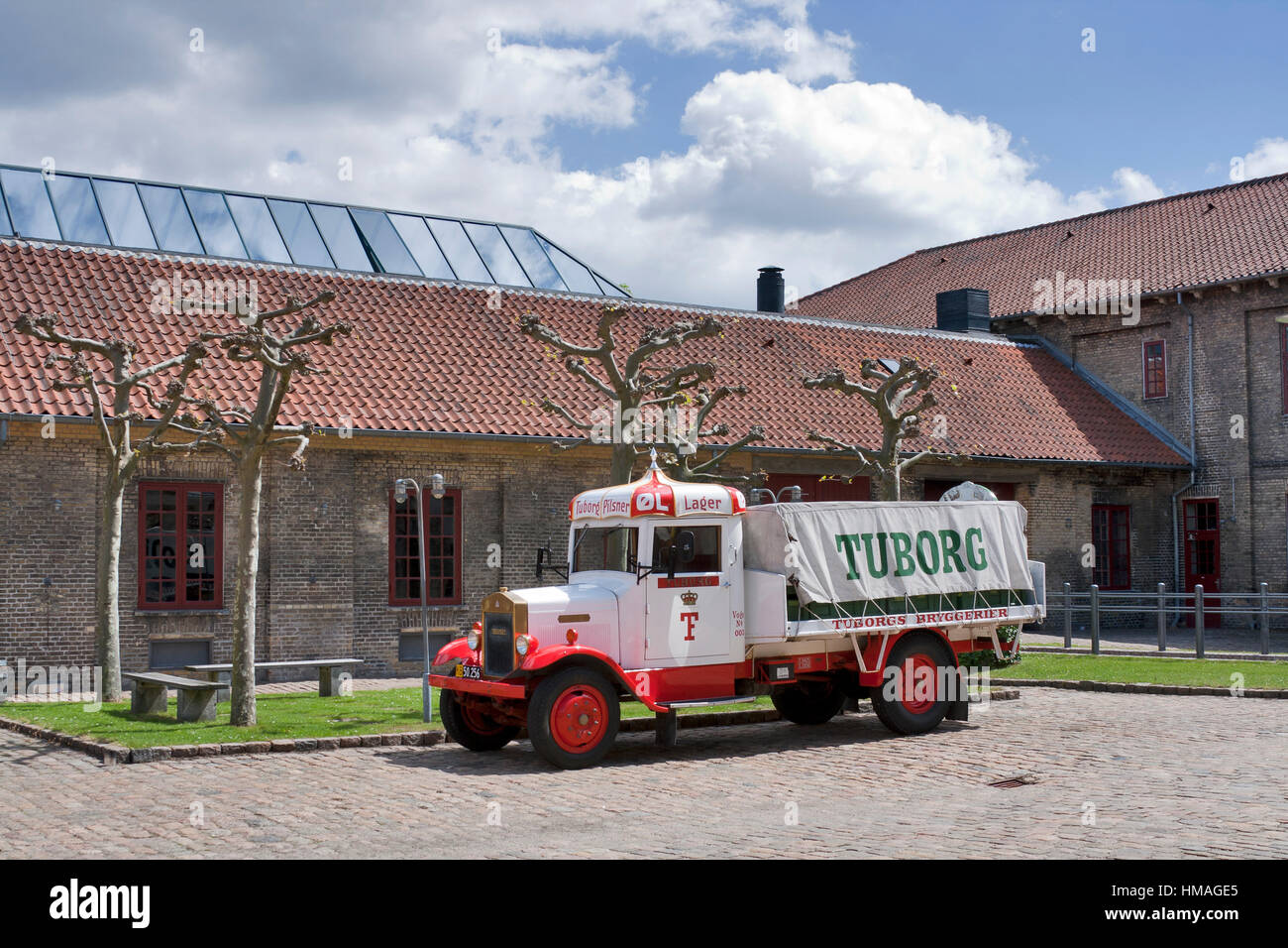 Copenhagen, Denmark - May 31, 2010: Old Carlsberg brewery with Tuborg truck in the backyard in Copenhagen, Denmark. http://www.visitcarlsberg.dk/Pages Stock Photo