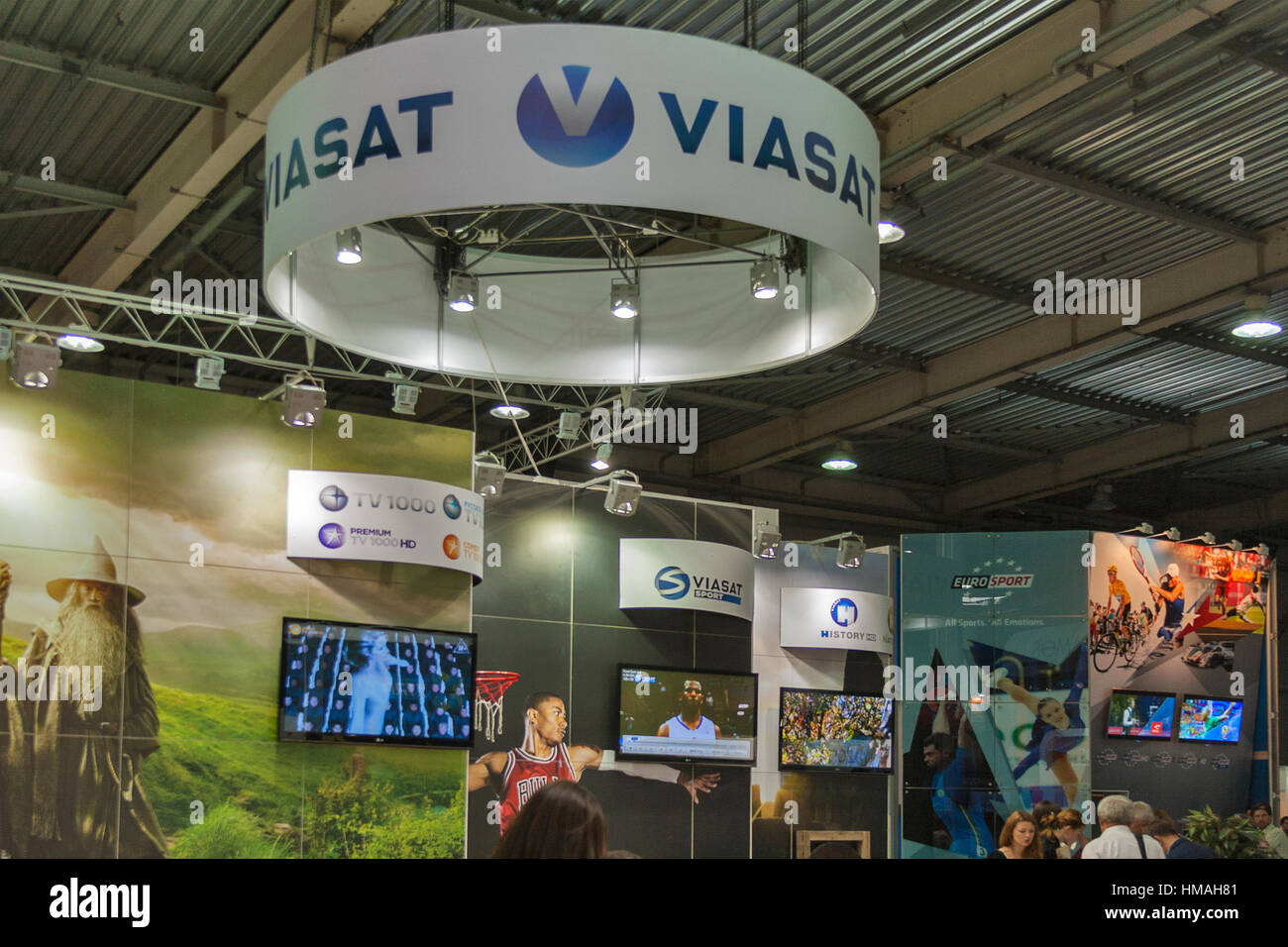 Visitors visit Viasat TV satellite provider company booth at Kyiv  International TV and Radio Fair 2013 in Kiev, Ukraine. It is the main  business foru Stock Photo - Alamy