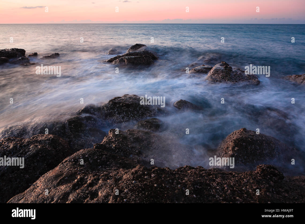 Waves and rocks shore long exposure Stock Photo - Alamy