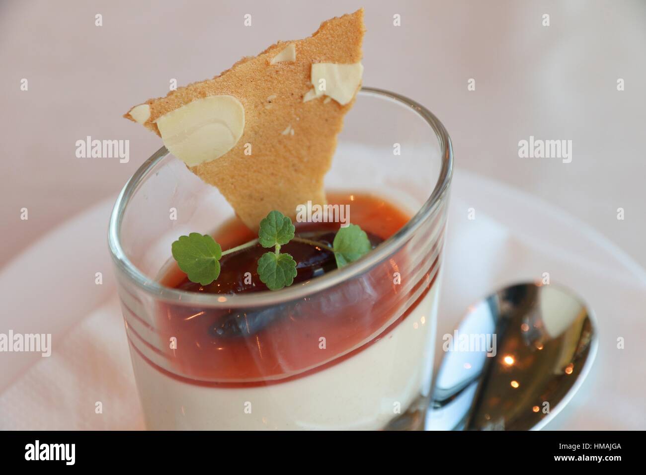 Yogurt with red fruit marmalade and herb for decoration Gourmet dessert