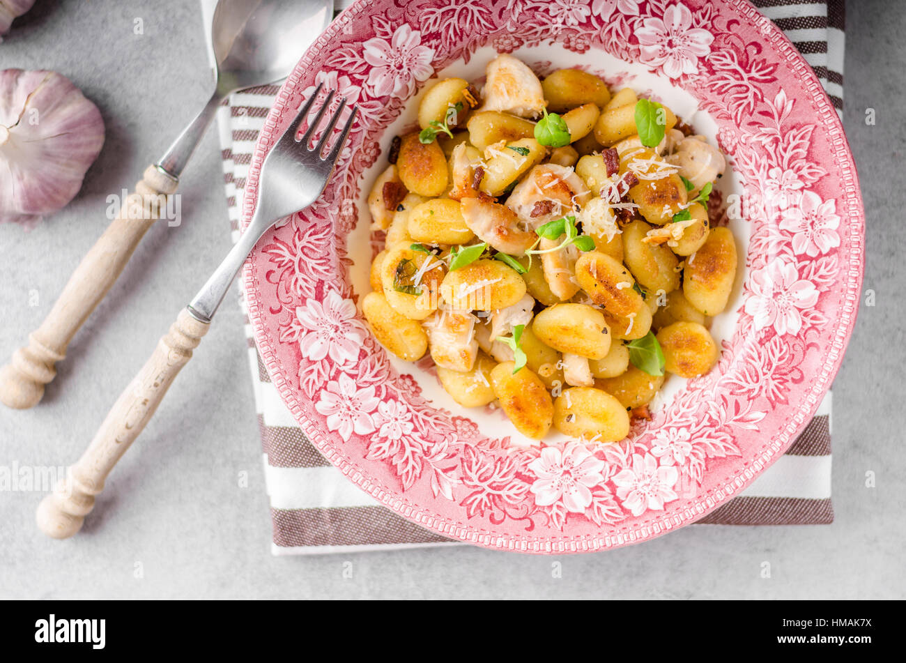 Roasted gnocchi with chicken, garlic and herbs, olive oil and parmesan