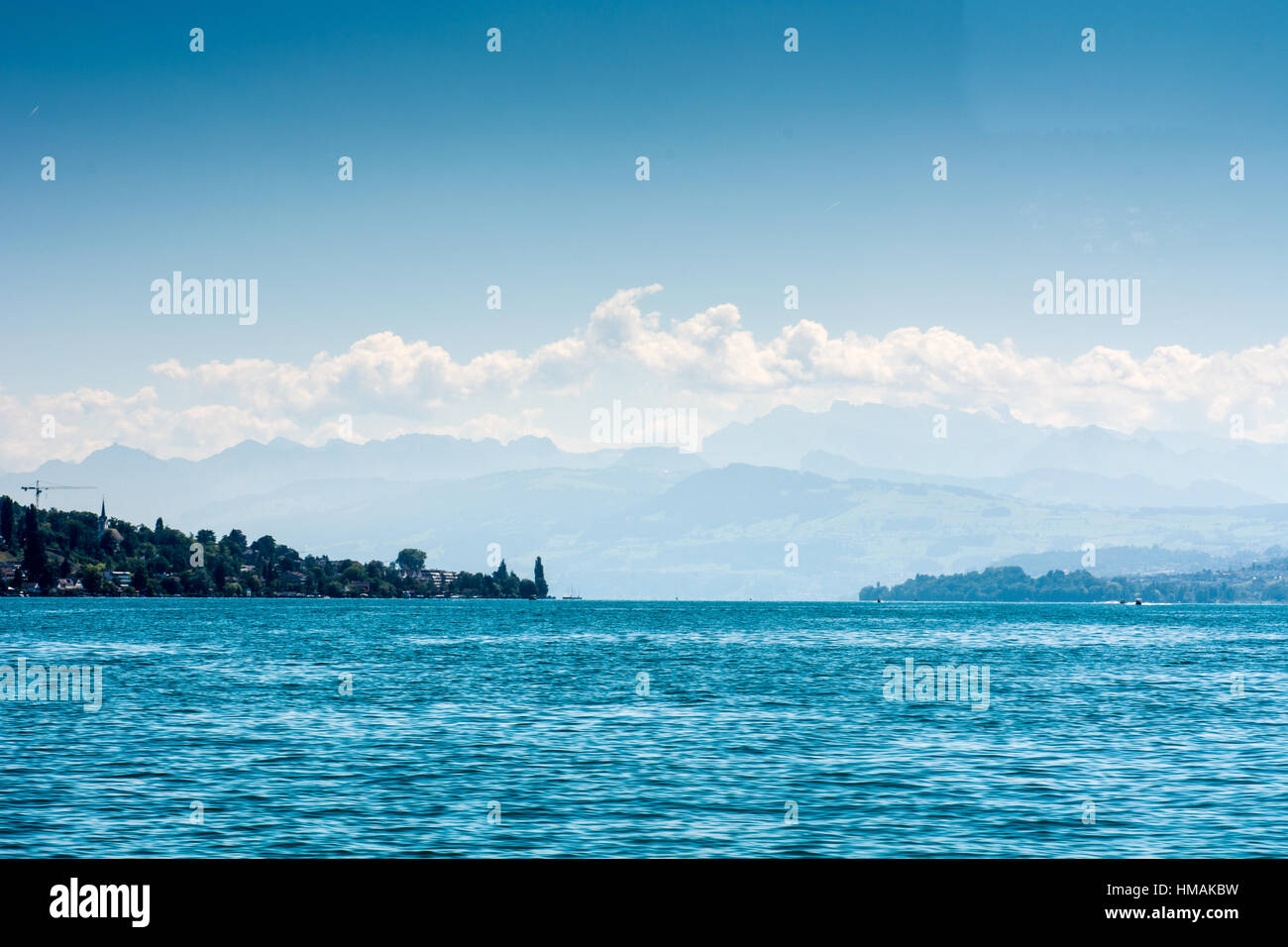 Lake Zurich with alps and blue sky background and landscape Stock Photo ...