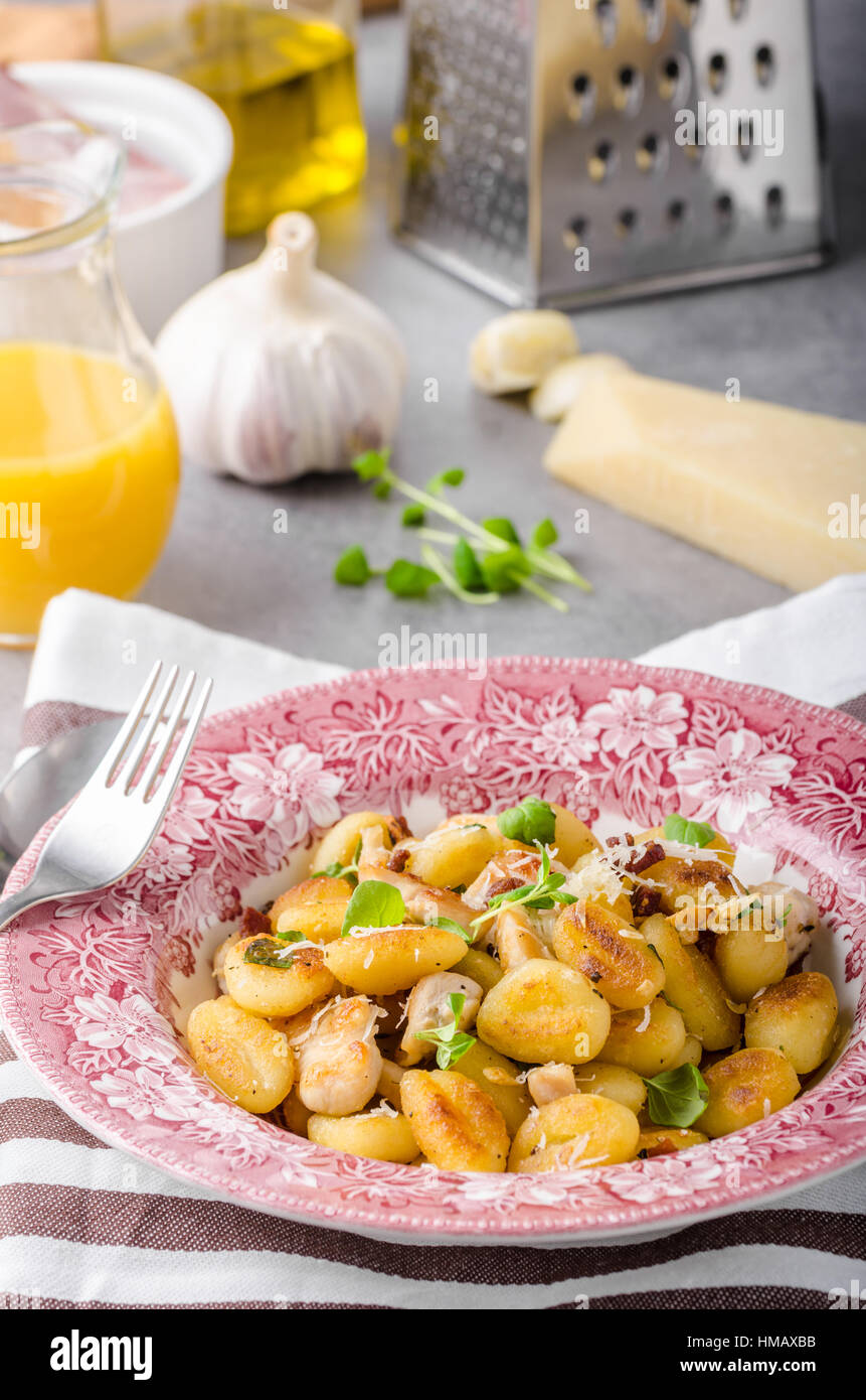 Roasted gnocchi with chicken, garlic and herbs, olive oil and parmesan