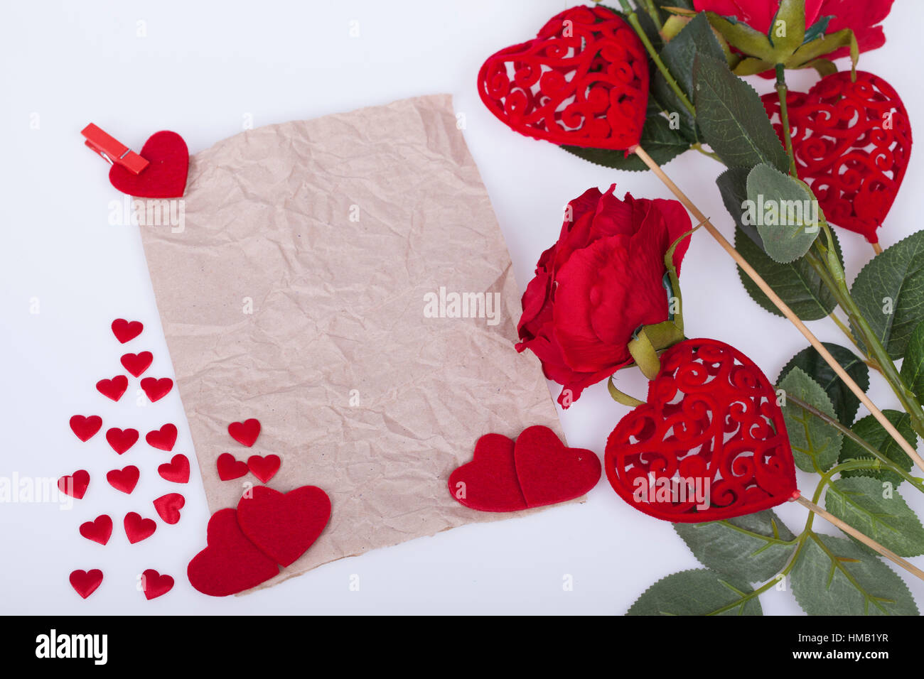 Red roses and red hearts on a white background Stock Photo - Alamy