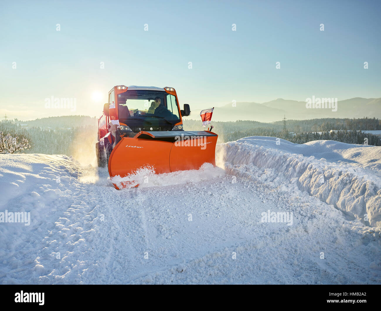 Snow plow, snow removal, winter road maintenance, Inntal, Tyrol, Austria Stock Photo