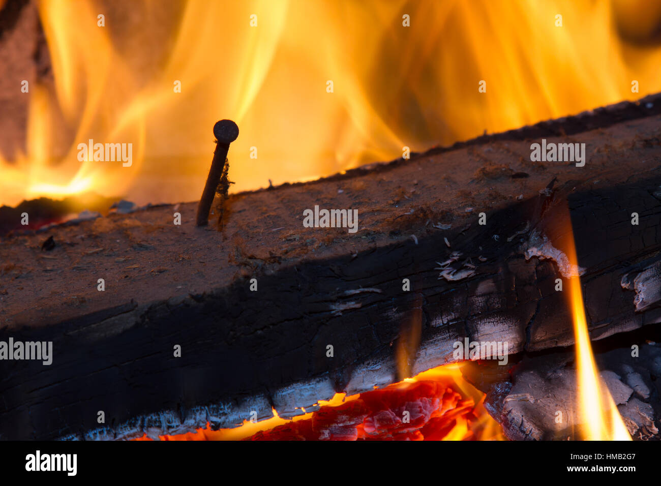 burning wood with nail Stock Photo Alamy