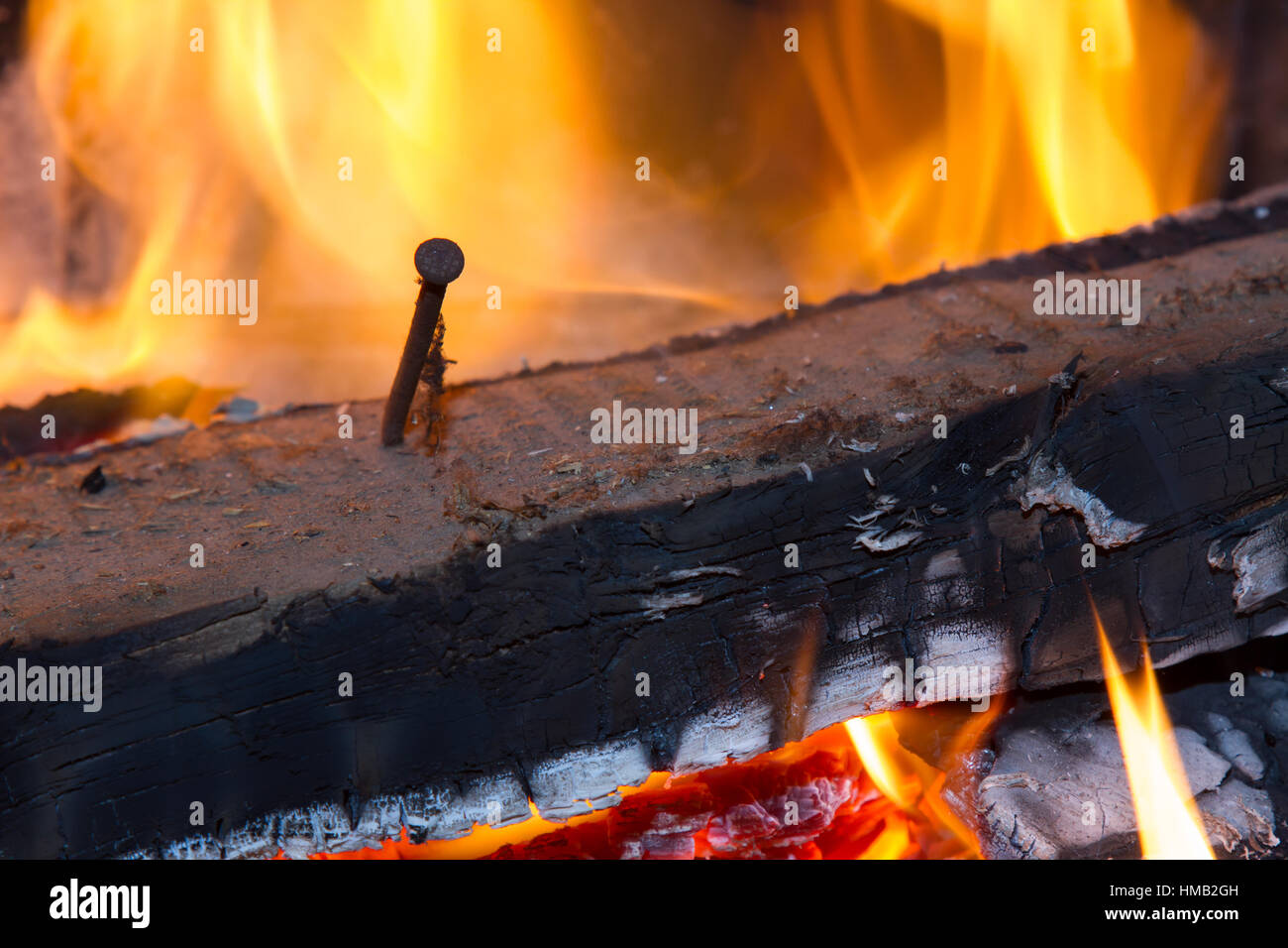 burning wood with nail Stock Photo Alamy