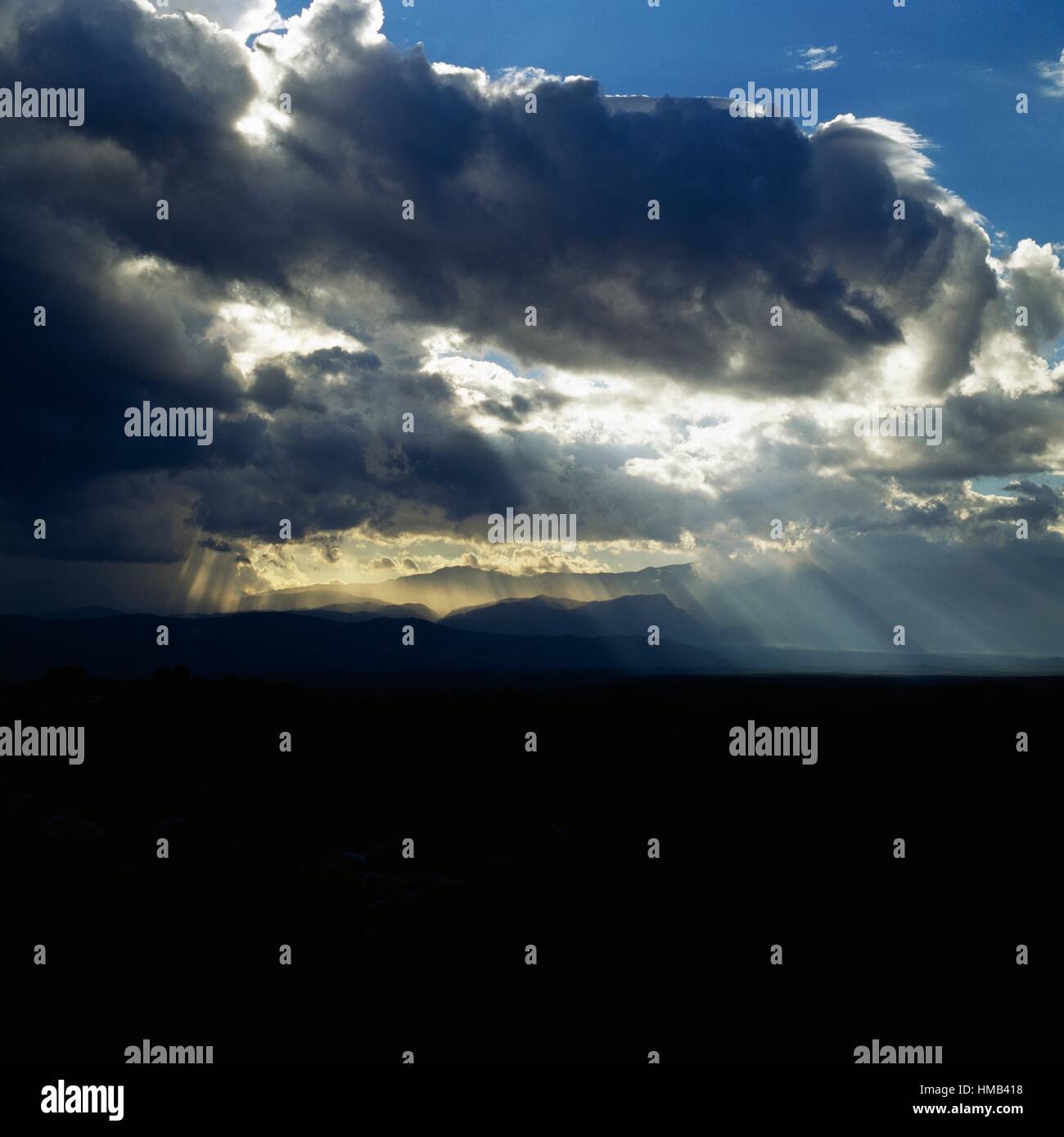 Mountain landscape with clouds and rays of sun, backlit, Abruzzo, Italy ...