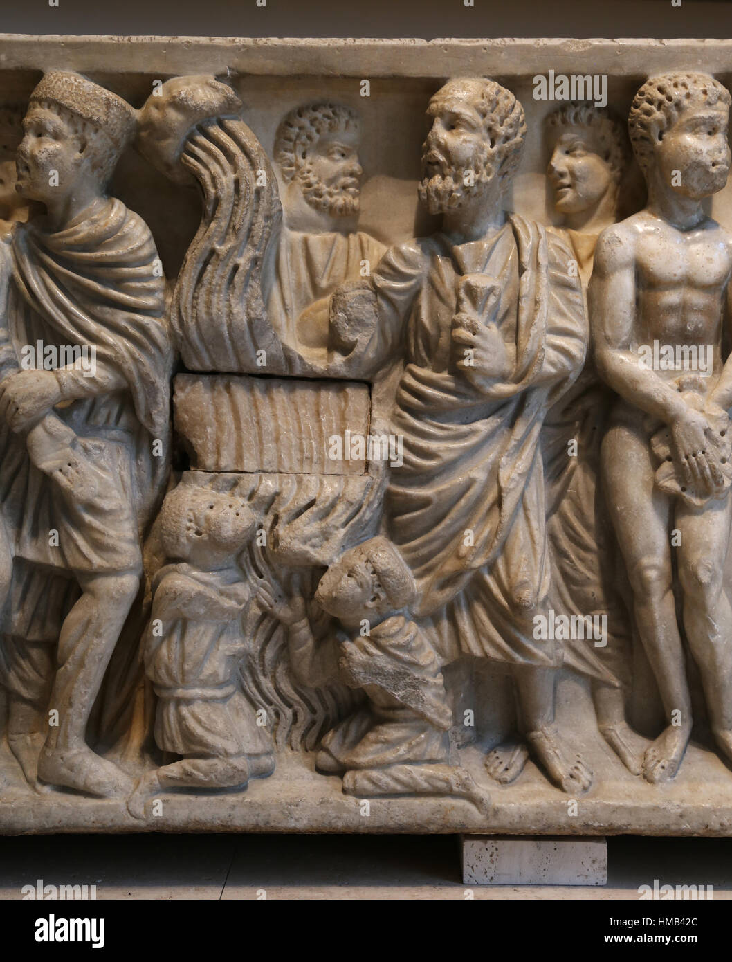 Sarcophagus from Astorga. Detail: Miracle of the spring (saint Peter in prision causes water to well up so that be can baptise 2 soldiers). Marble. Ci Stock Photo