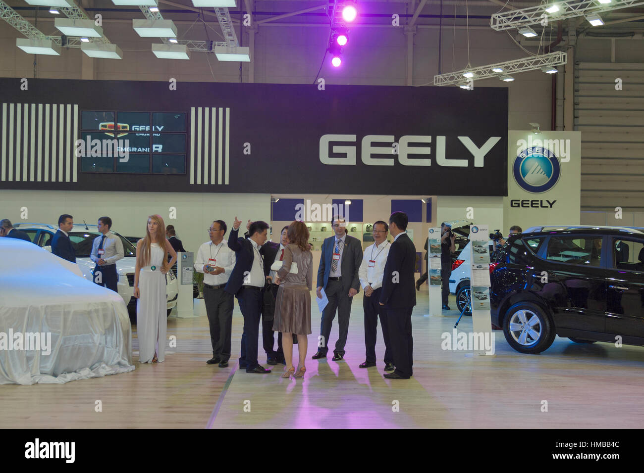 KIEV, UKRAINE - MAY 29: Delegation of Chinese managers visit Geely booth on display of SIA' 2013 The 21st Kyiv International Motor Show in Internation Stock Photo