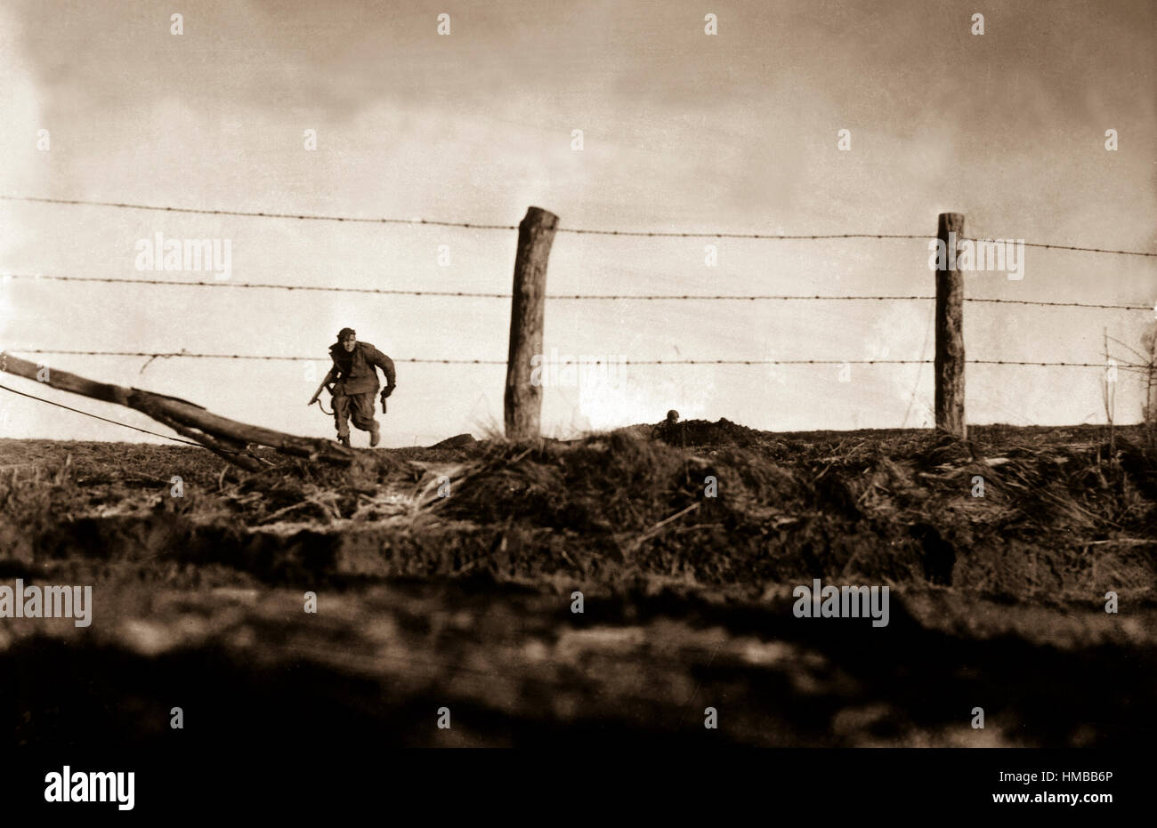 Infantryman goes out on a one-man sortie, covered by a buddy in the background.  82nd Airborne Division, Bra, Belgium. December 24, 1944. Edgren. (Army) NARA FILE #:  111-SC-197861 WAR & CONFLICT BOOK #:  1073 Stock Photo