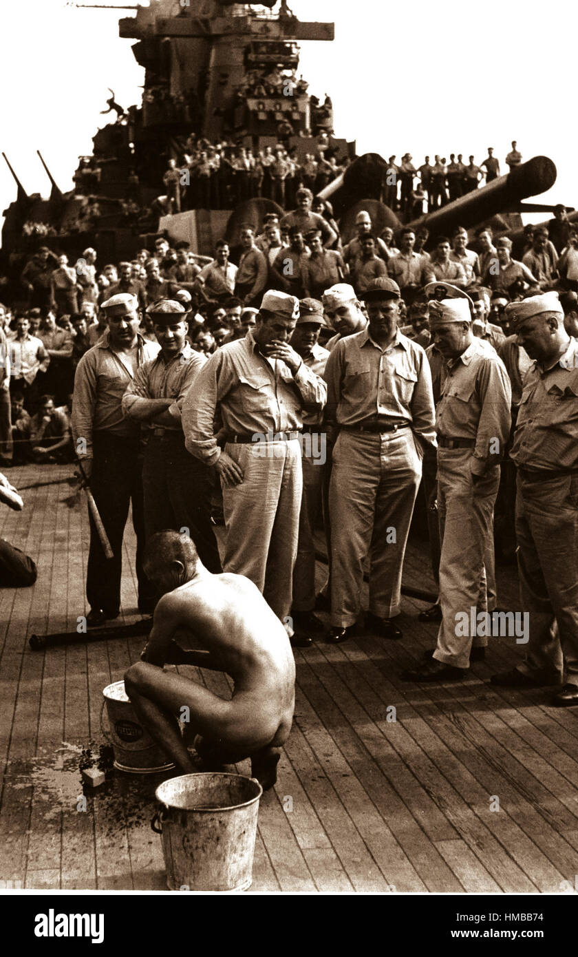 Japanese prisoners of war are bathed, clipped, 'deloused,' and issued GI clothing as soon as they are taken aboard the USS NEW JERSEY.  Prisoner bathing.  December 1944.  Lt. Comdr. Charles Fenno Jacobs.  (Navy) Exact Date Shot Unknown NARA FILE #:  080-G-469956 WAR & CONFLICT BOOK #:  1305 Stock Photo
