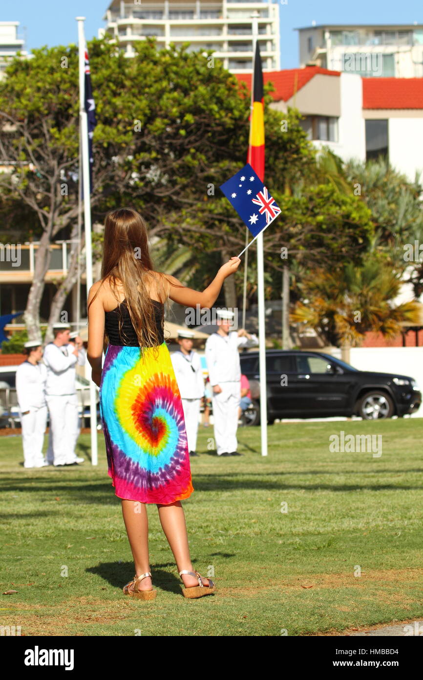 A young pre-teen girl waves a small Australian Flag during the 2017 Australia Day Celebrations at Kings Beach, Caloundra, Queensland, Australia. Stock Photo