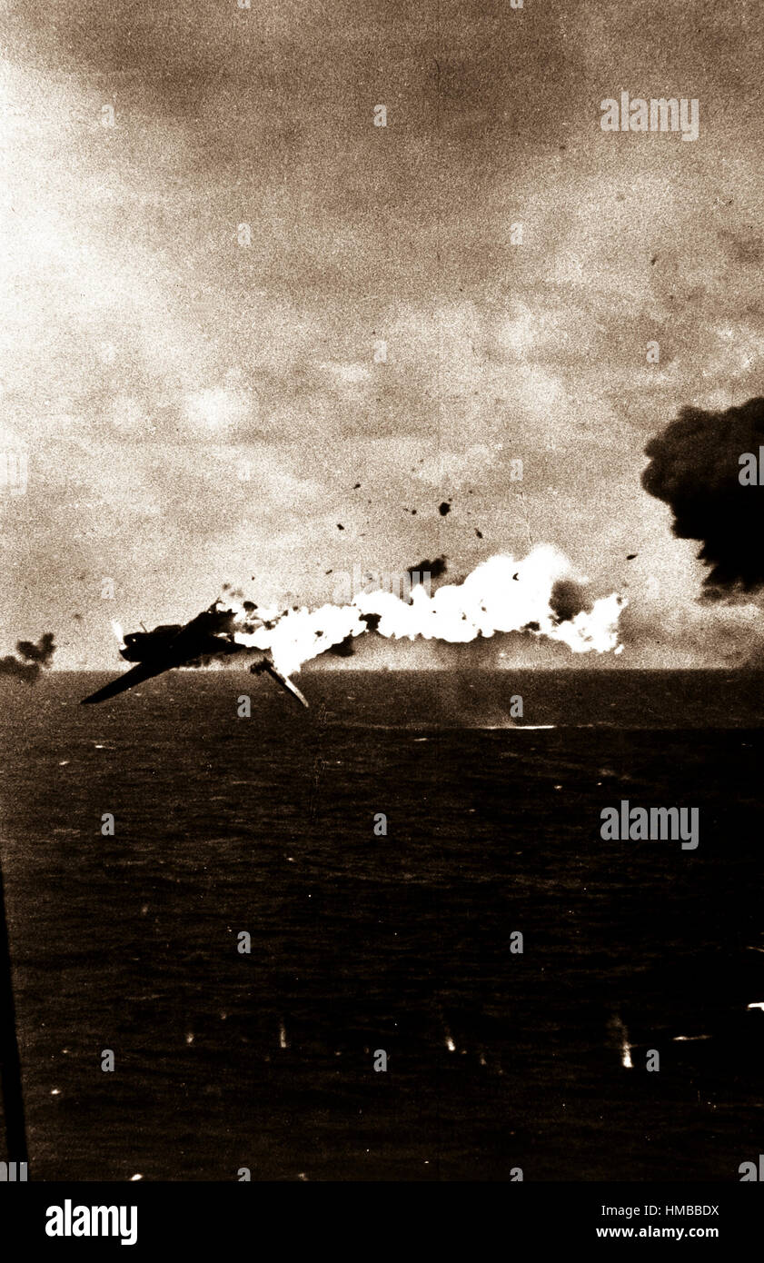 Jap torpedo bomber explodes in air after direct hit by 5 inch shell from U.S. aircraft carrier as it attempted an unsuccessful attack on carrier, off Kwajalein.  U.S.S. Yorktown, December 4, 1943.  CPhoM. Alfred N. Cooperman.  (Navy) NARA FILE #:  080-G-415001 WAR & CONFLICT BOOK #:  974 Stock Photo