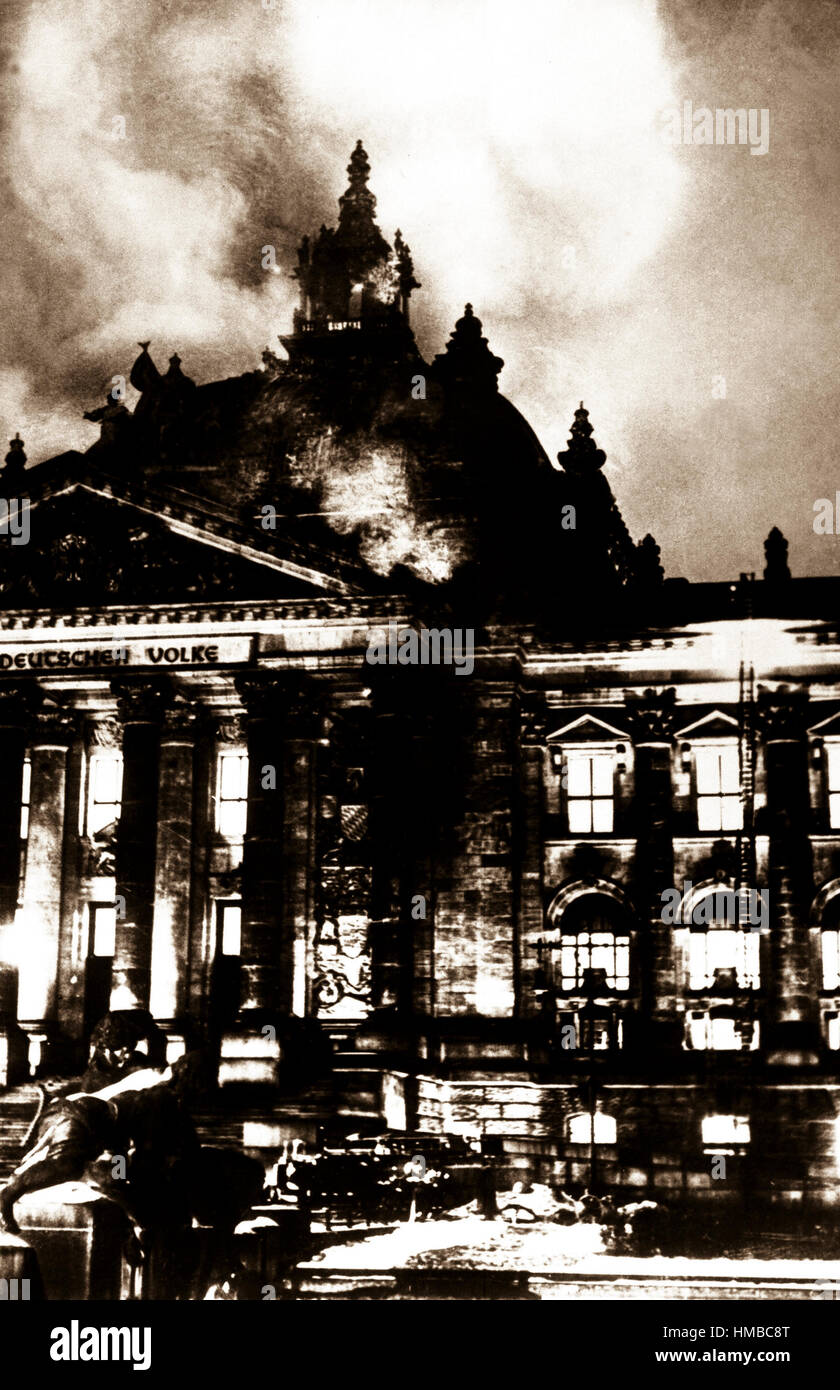 Firemen work on the burning Reichstag Building in February 1933, after fire broke out simultaneously at 20 places.  This enabled Hitler to seize power under the pretext of 'protecting' the country from the menace to its security.  Berlin. Stock Photo