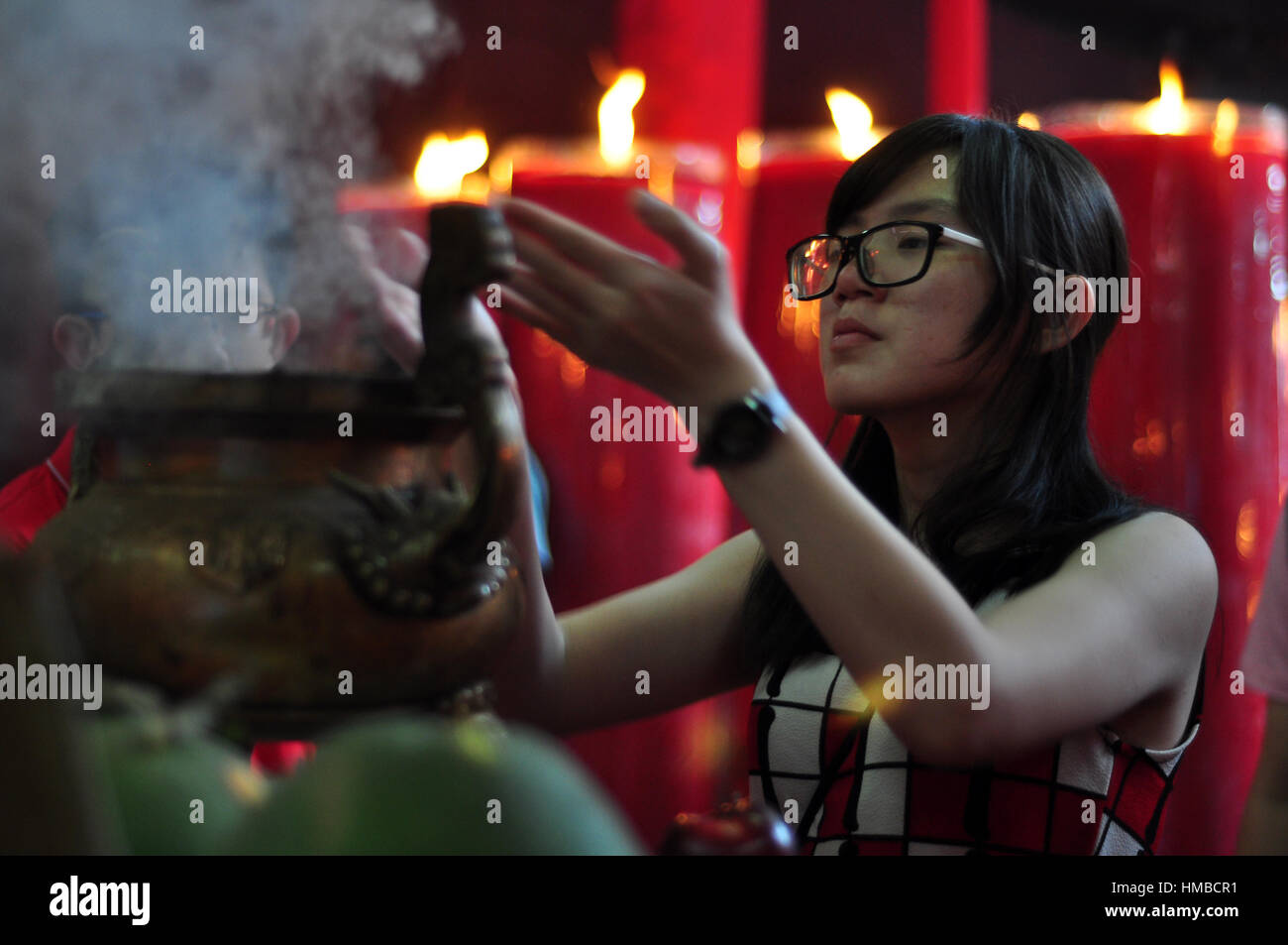 Jakarta, Indonesia - January 29, 2017: Chinese people praying to the gods in Chinese Lunar new year celebration at Jin De Yuan temple, Jakarta Stock Photo