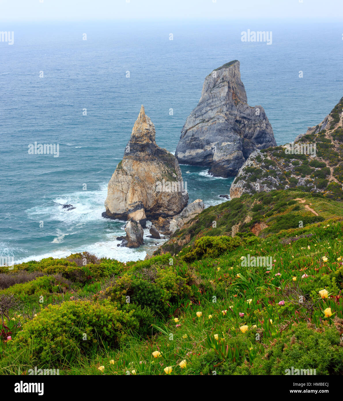 Atlantic ocean coast (granite boulders and sea cliffs) in cloudy ...