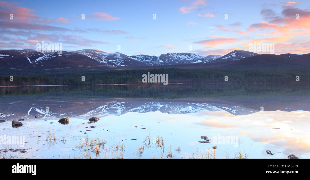 Northern Coire's reflected in Loch Morlich Stock Photo
