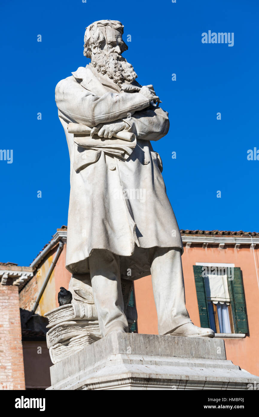 Statue of Nicolo Tommaseo at Campo Santo Stefano, Venice, Italy in January Stock Photo