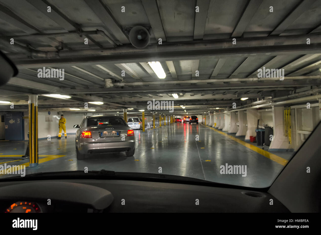 Golfo Aranci, Italy - September 23, 2016: Cars doing maneuver in a vehicle deck Stock Photo