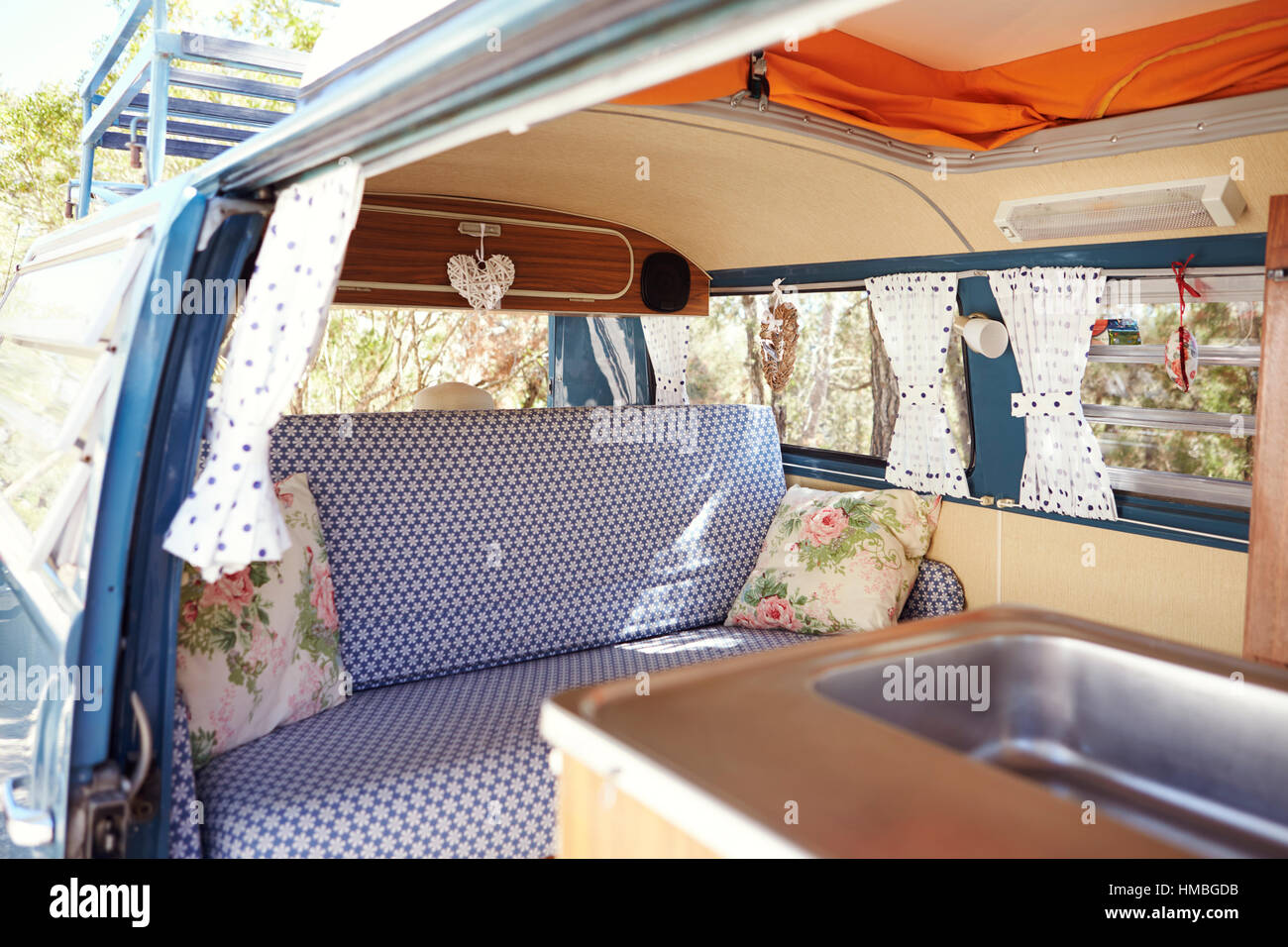 A Retro Camper Van With Door Open To Show Interior Stock Photo