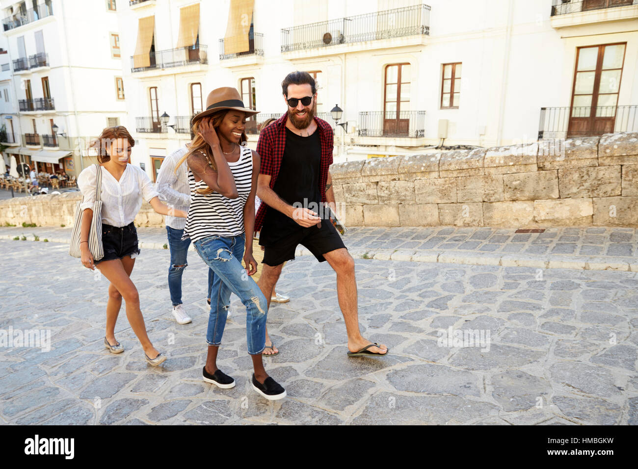 Adult friends on holiday walking, Ibiza, Spain, close up Stock Photo
