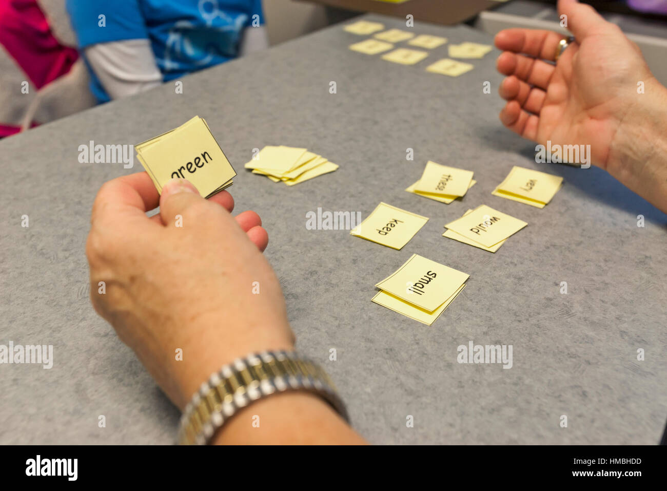 A teacher instructing a student in learning to read. Stock Photo