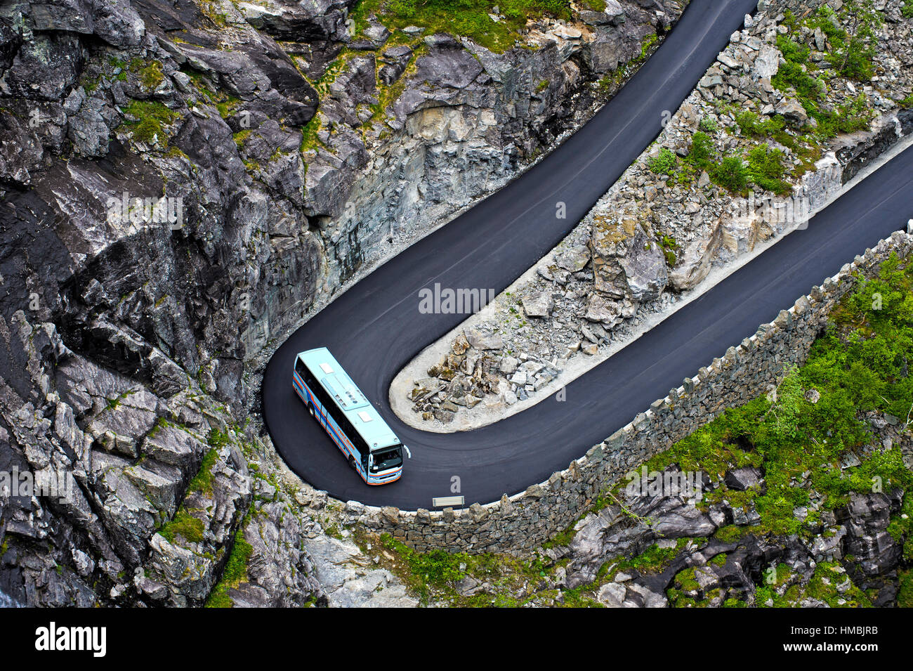 Coach on a mountainous road. Coach in a hairpin bend, hilly road leading to Trollstigen, near Andalsnes, Norway Stock Photo