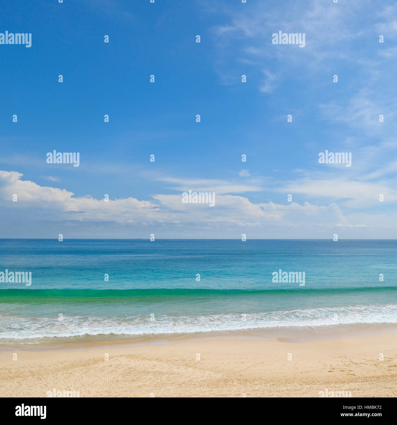 ocean, sandy beach and blue sky Stock Photo - Alamy