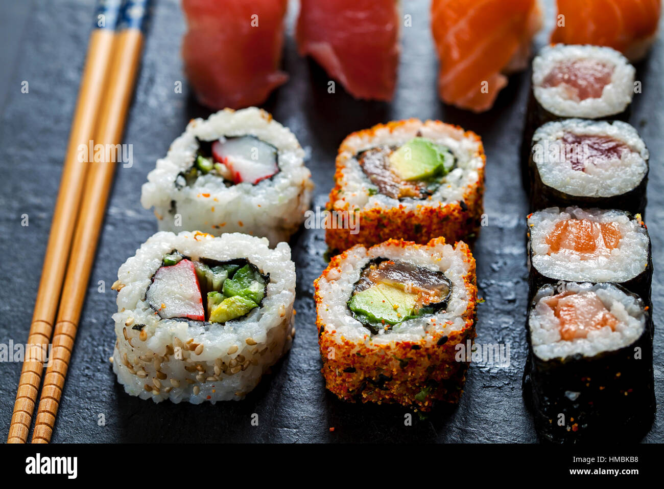 Salmon and tuna sushi on black slate plate Stock Photo