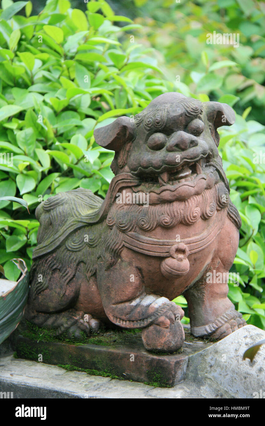 Statue of a Chinese guardian lion in the Baoguo monastery in Emei Shan (China). Stock Photo