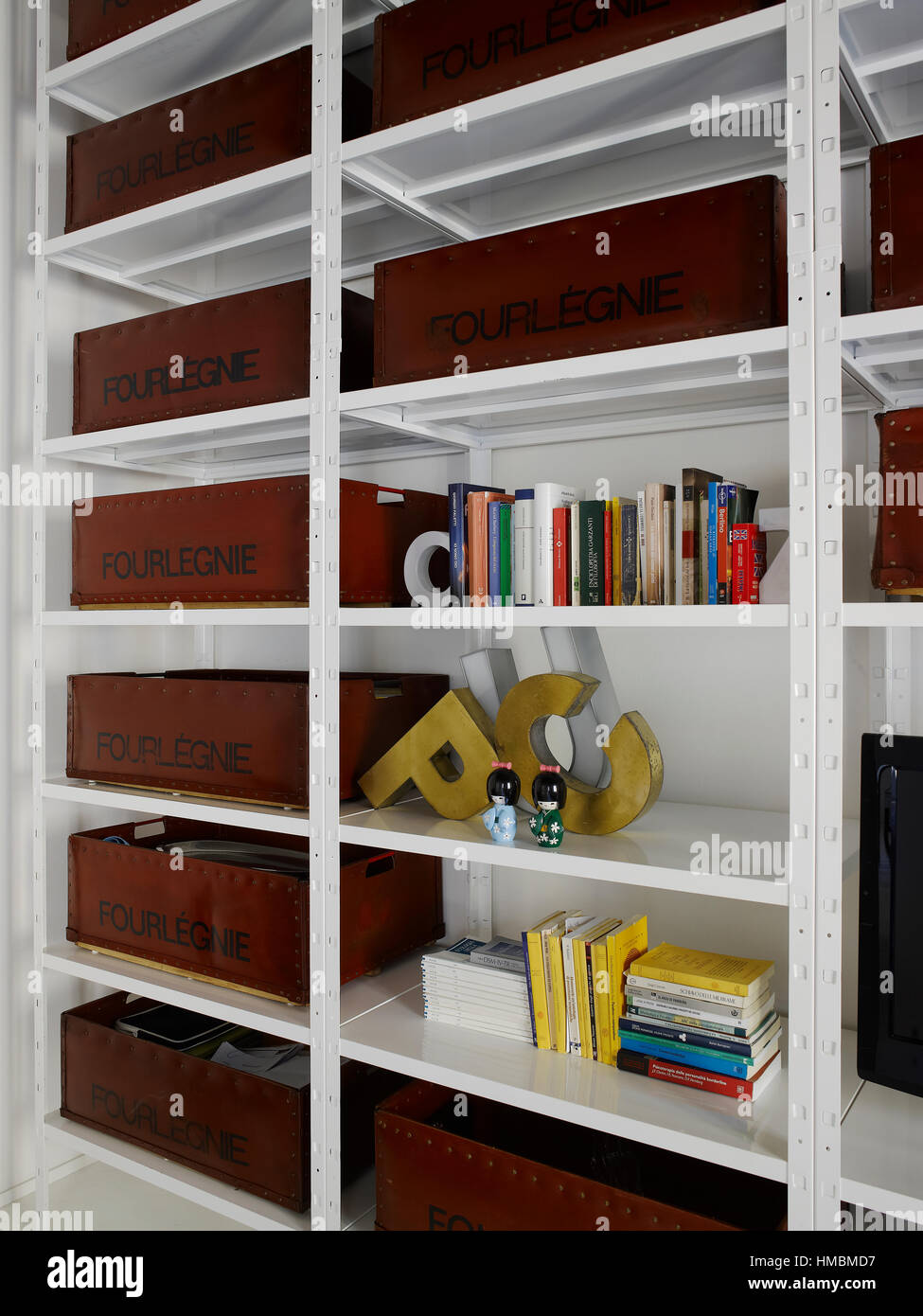 Interior of a contemporary house with a beautiful white colored aluminum shelving unit Stock Photo