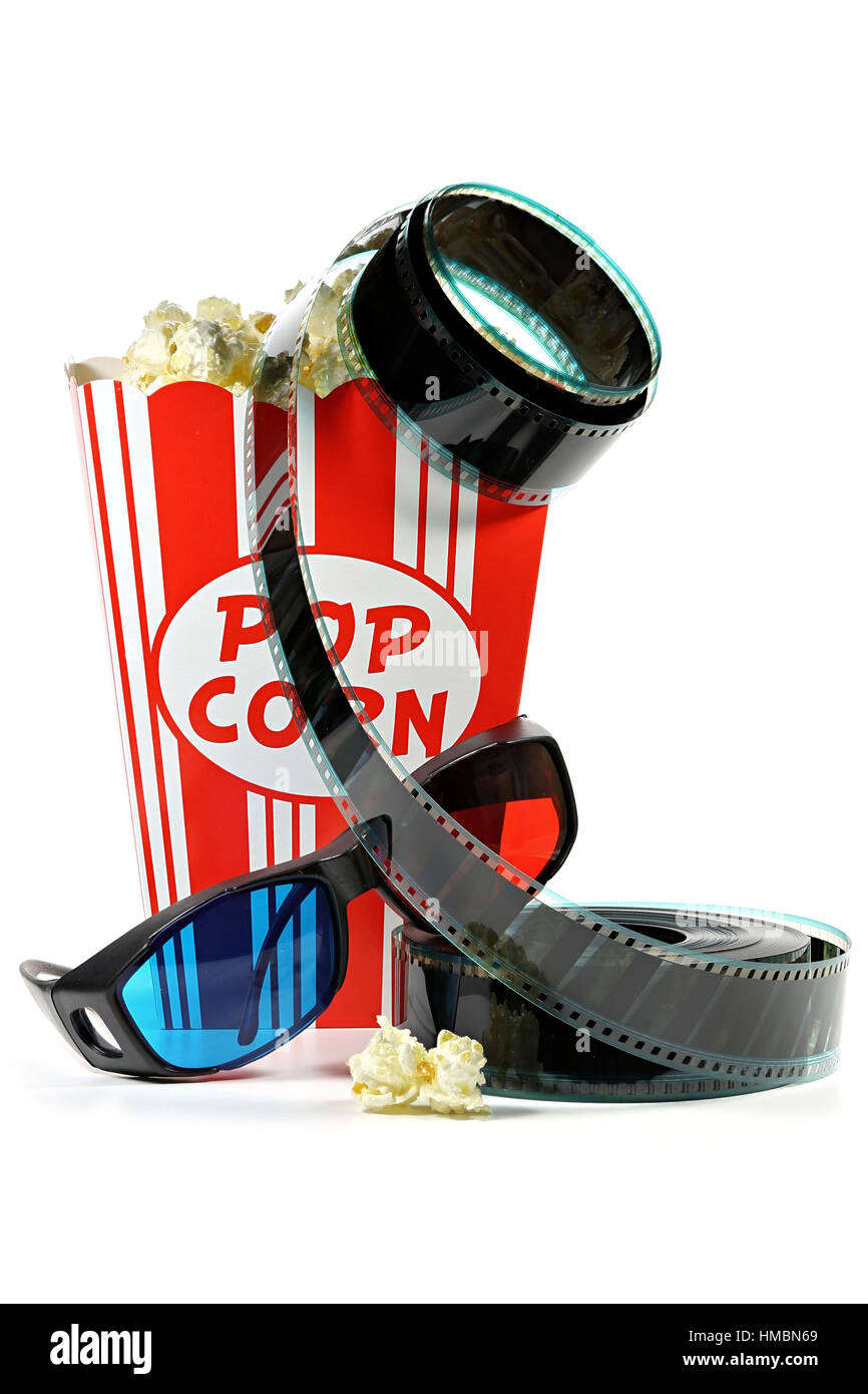 popcorn in a cardboard container with filmstrip and anaglyph glasses isolated on white background Stock Photo