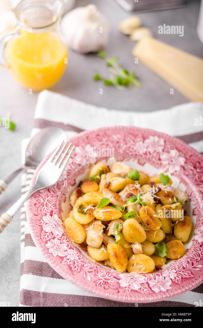 Roasted gnocchi with chicken, garlic and herbs, olive oil and parmesan