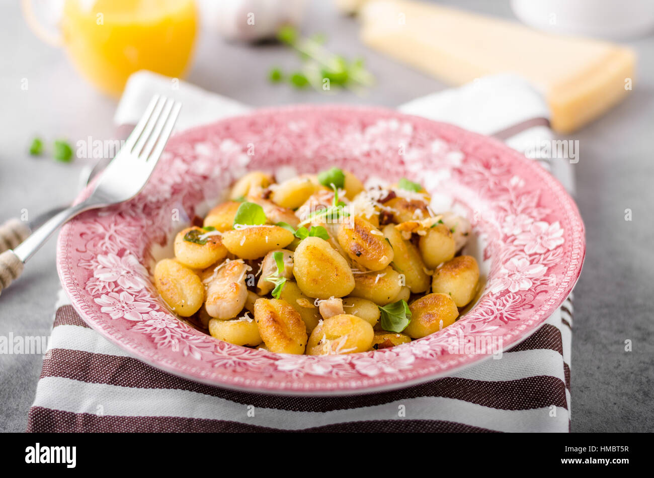 Roasted gnocchi with chicken, garlic and herbs, olive oil and parmesan