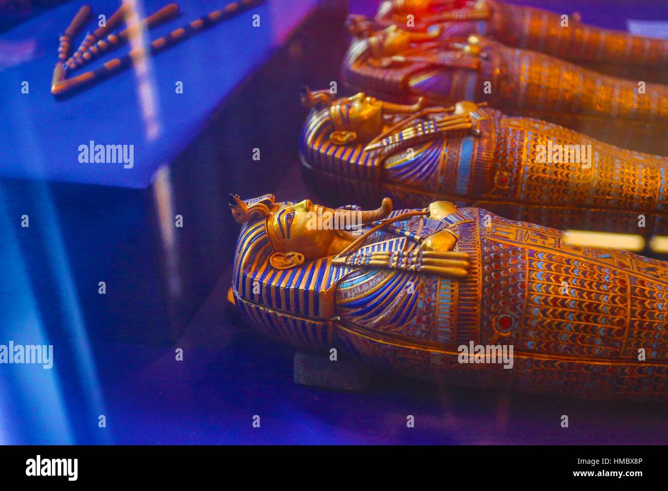 Four small gold mummiform coffins placed in the canopic urns, from the