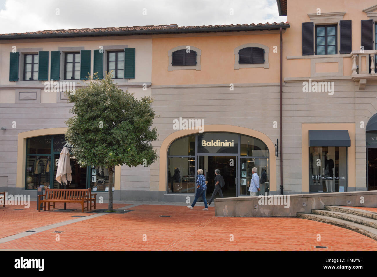 MUGELLO, ITALY - SEPTEMBER 11, 2014: People walk along Baldinini store in  McArthurGlen Designer Outlet Barberino. Baldinini is an italian footwear  man Stock Photo - Alamy