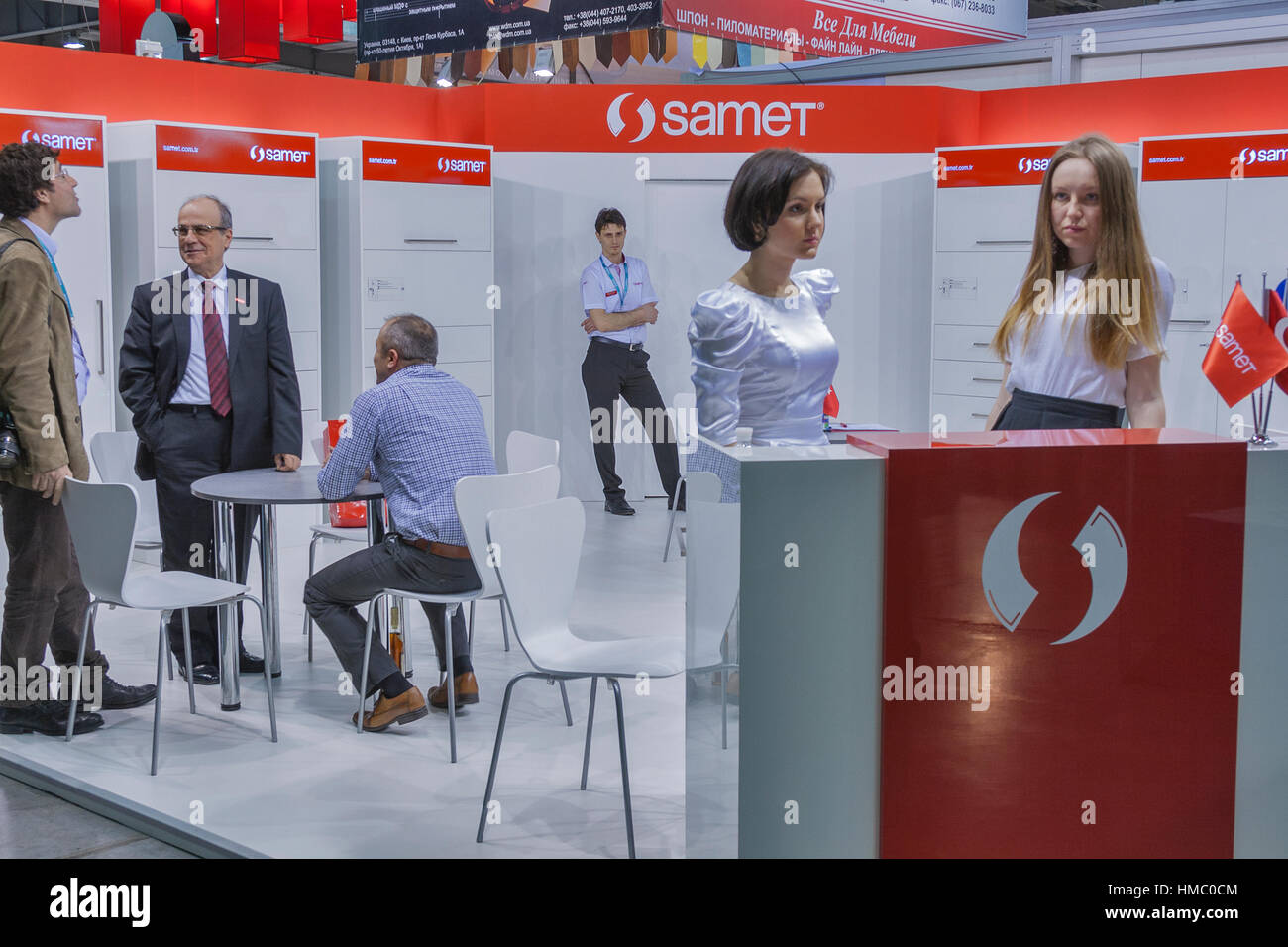 Visitors visit Samet furniture accessories company booth display at Kiev International Furniture Forum at Kyiv Expo Plaza Exhibition Center in Kiev, U Stock Photo