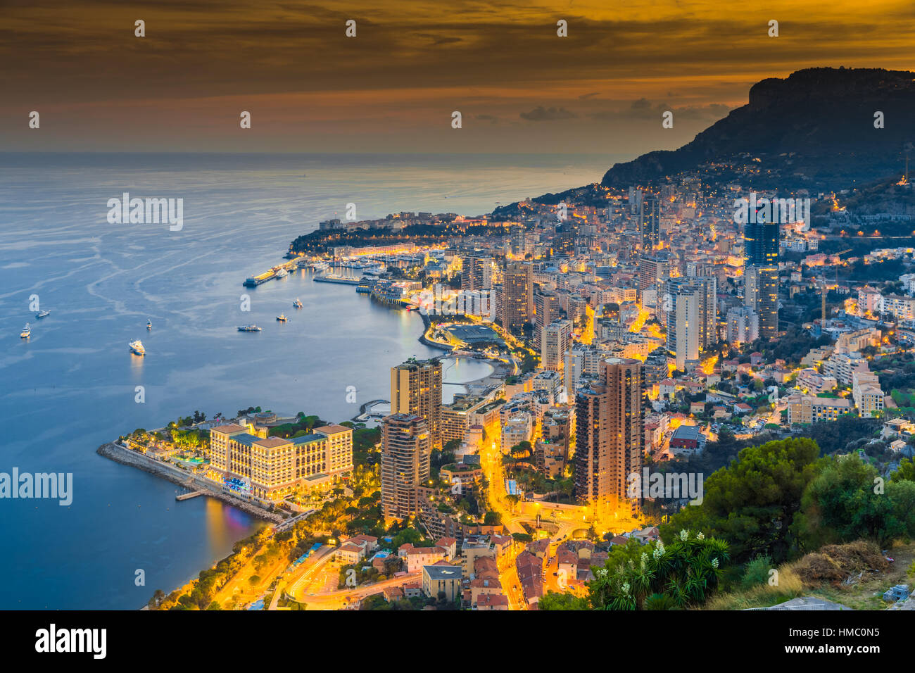 Monaco, Monte-Carlo, 26 September 2016: Aerial panoramic view the night city from hotel Vista, night illumination of yachts, streets, buildings, long  Stock Photo