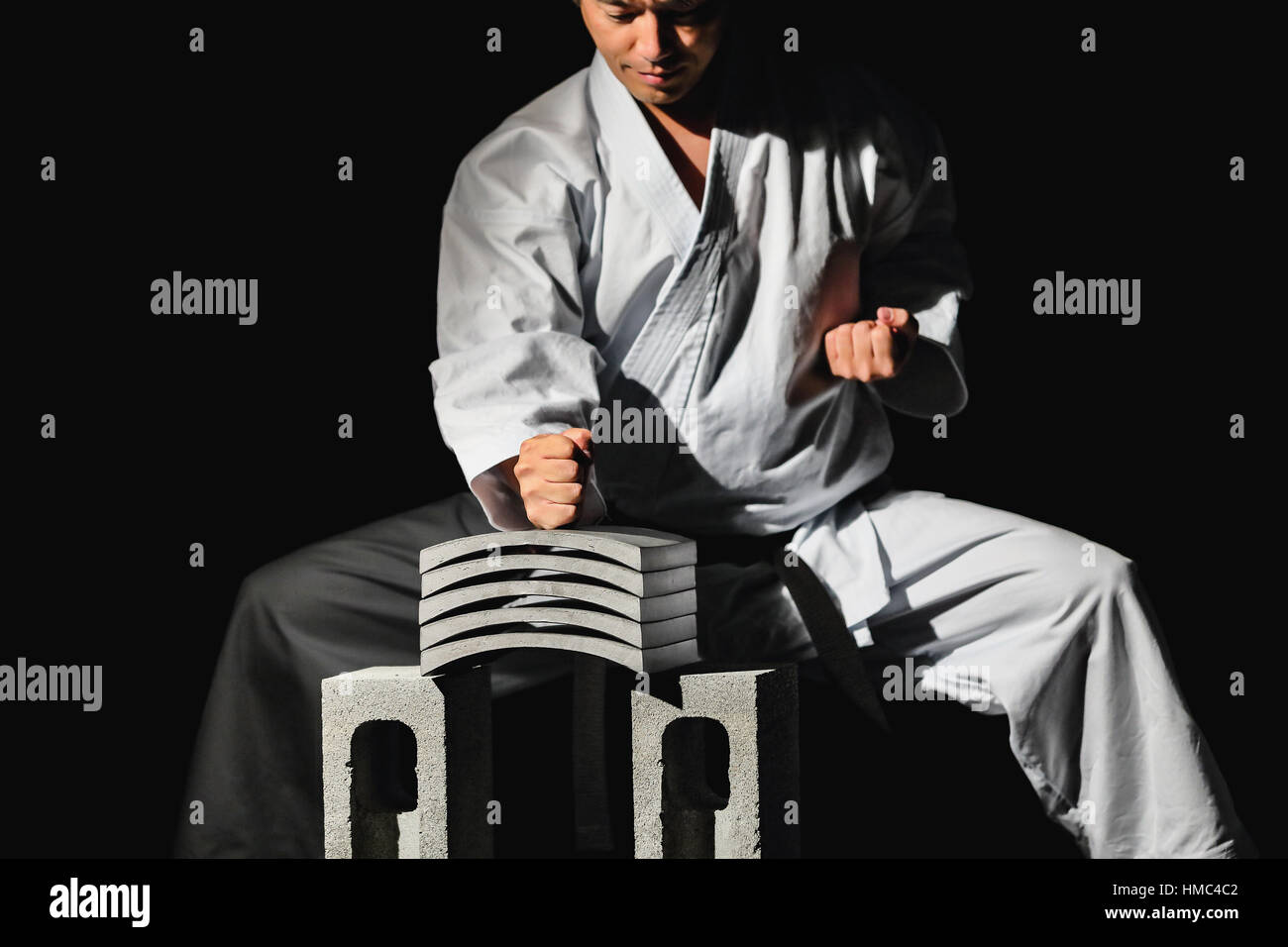 Japanese karate master breaking tiles Stock Photo Alamy