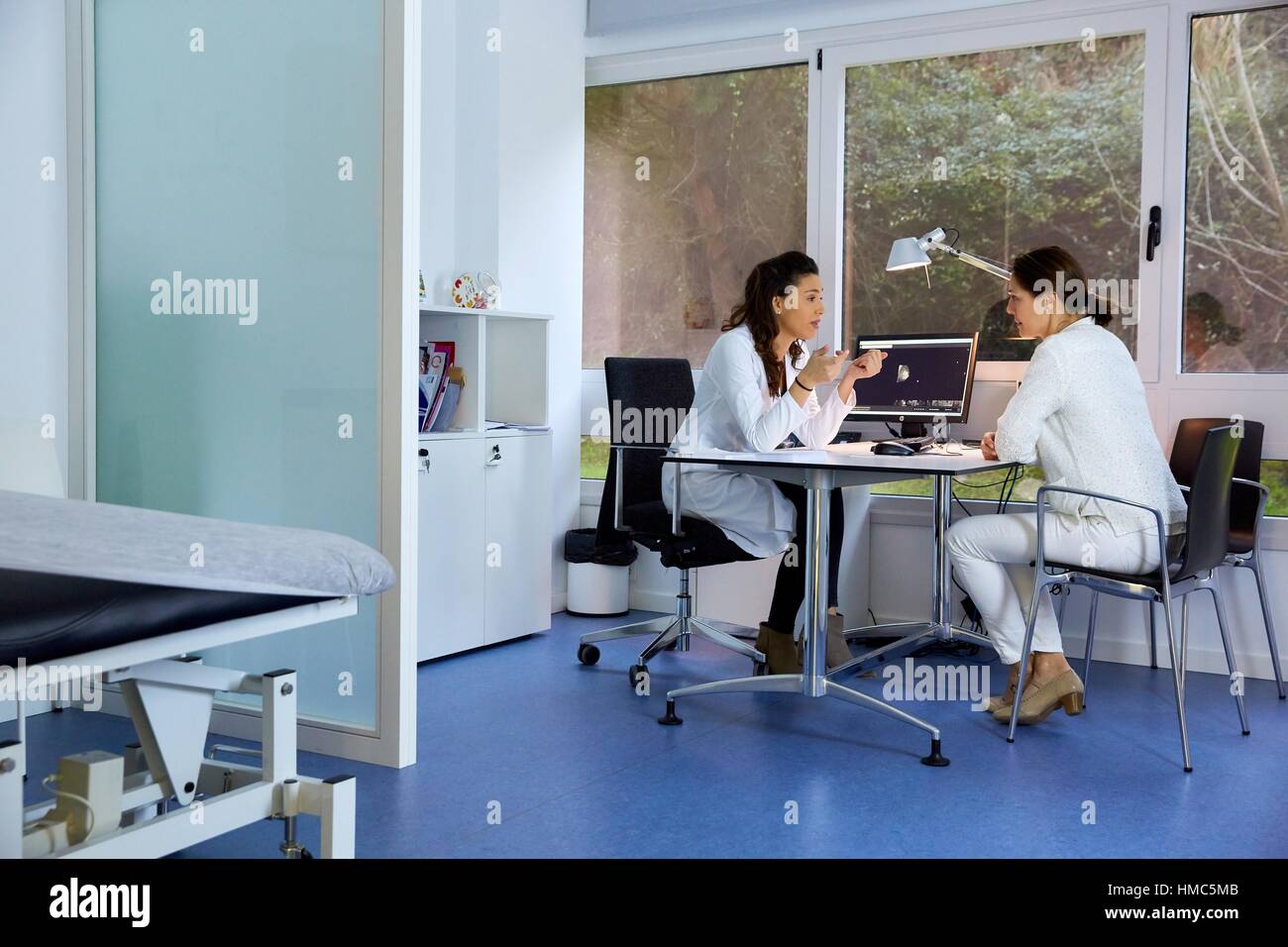 Doctor attending to patient medical consultation. Office. Plastic