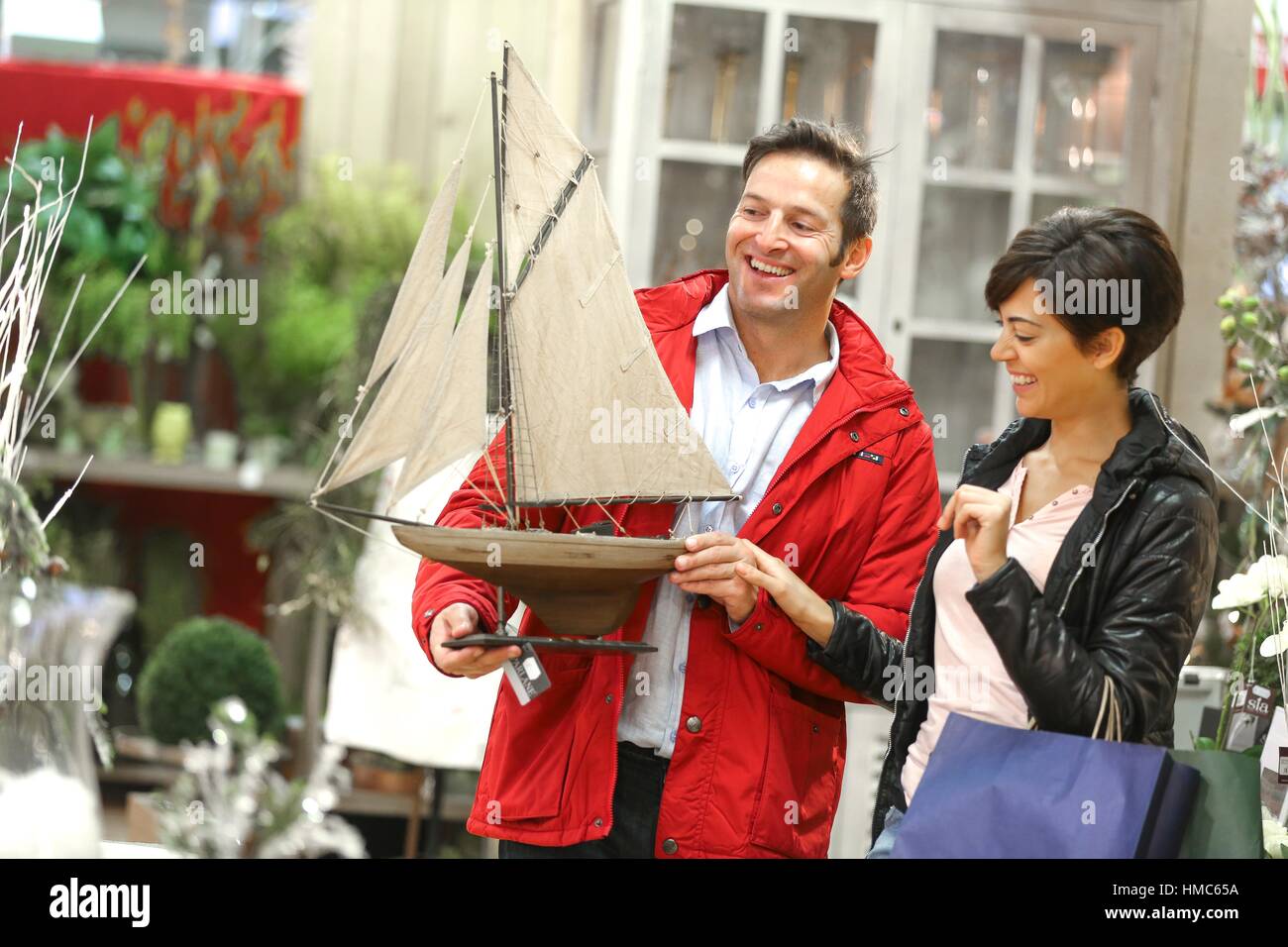 Couple buying a boat decor Stock Photo