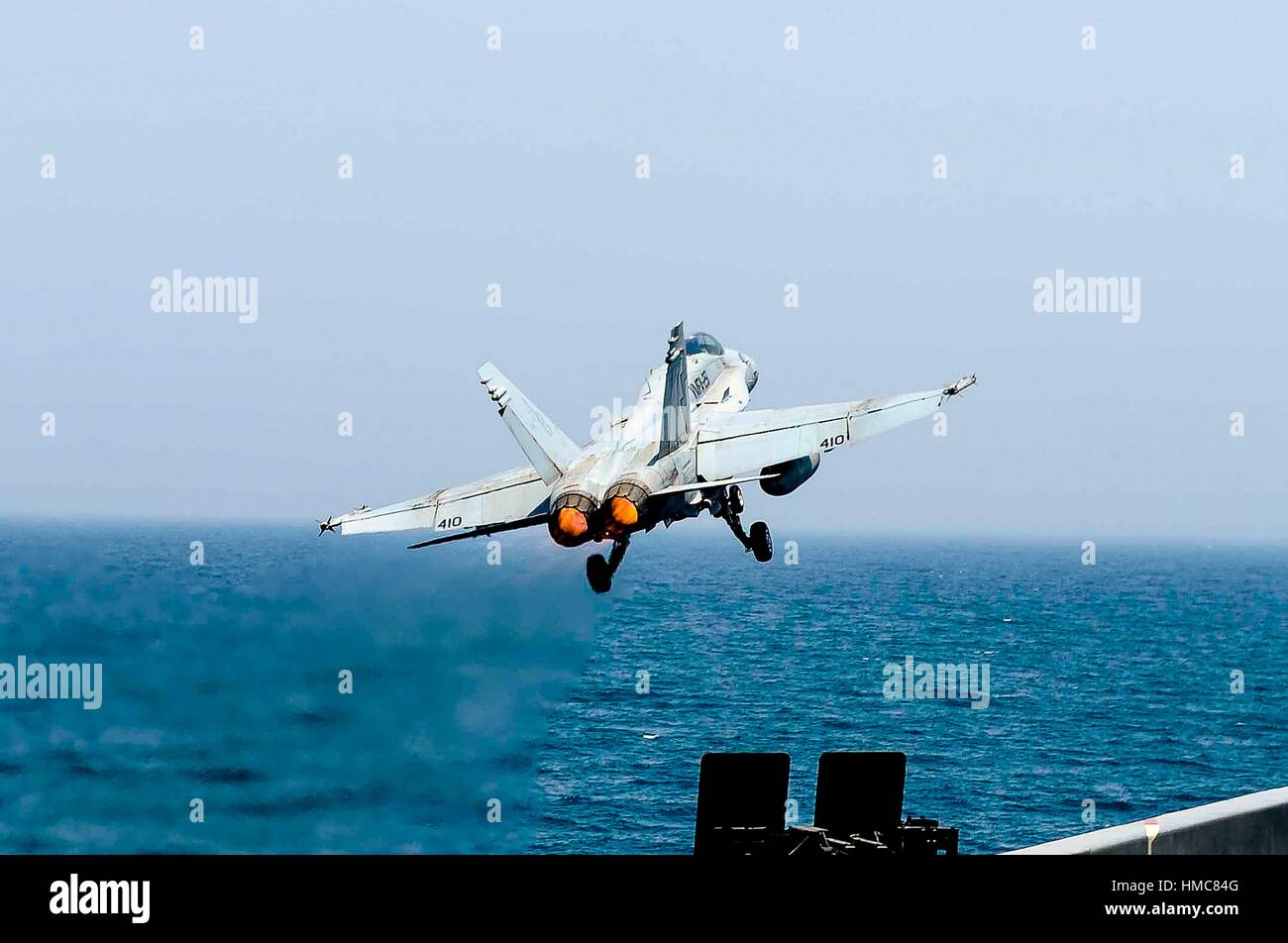 ARABIAN GULF (July 2, 2015) An F/A-18C Hornet assigned to the Thunderbolts of Marine Strike Fighter Squadron (VMFA) 251 launches from the flight deck Stock Photo