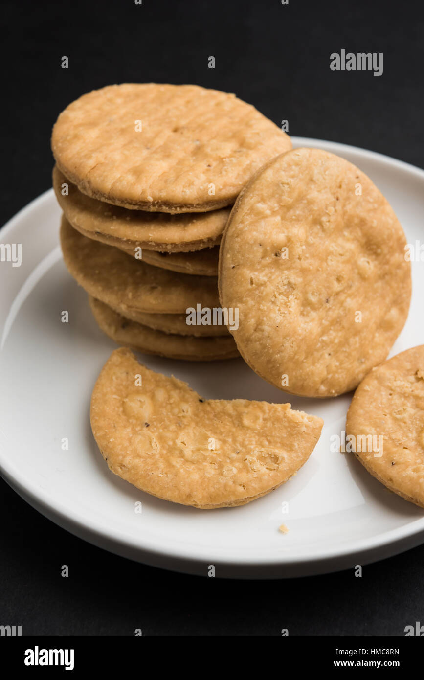 spicy fried mathri or mathari which is an indian snack served with a ...