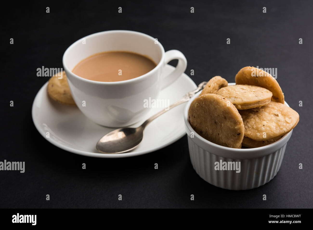 spicy fried mathri or mathari which is an indian snack served with a ...