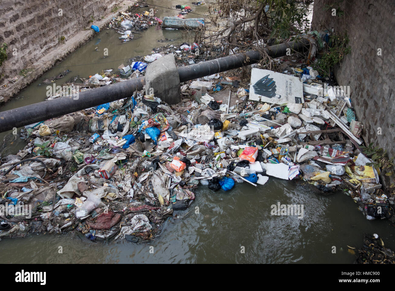 HYDERABAD, INDIA - FEBRUARY 02,2017  Sewage canal clogged by floating waste in Hyderabad,India Stock Photo