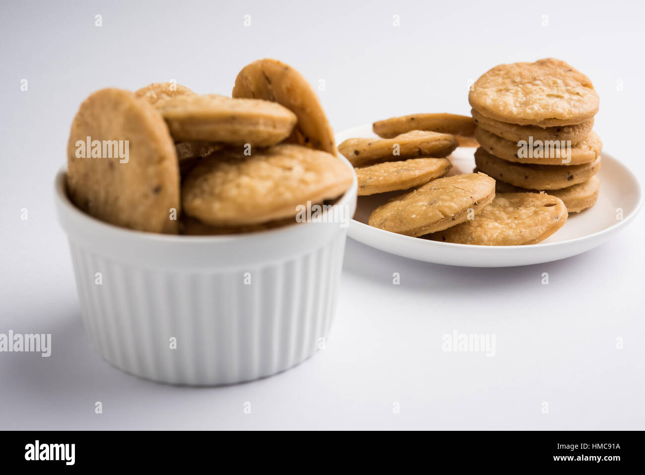 spicy fried mathri or mathari which is an indian snack served with a ...